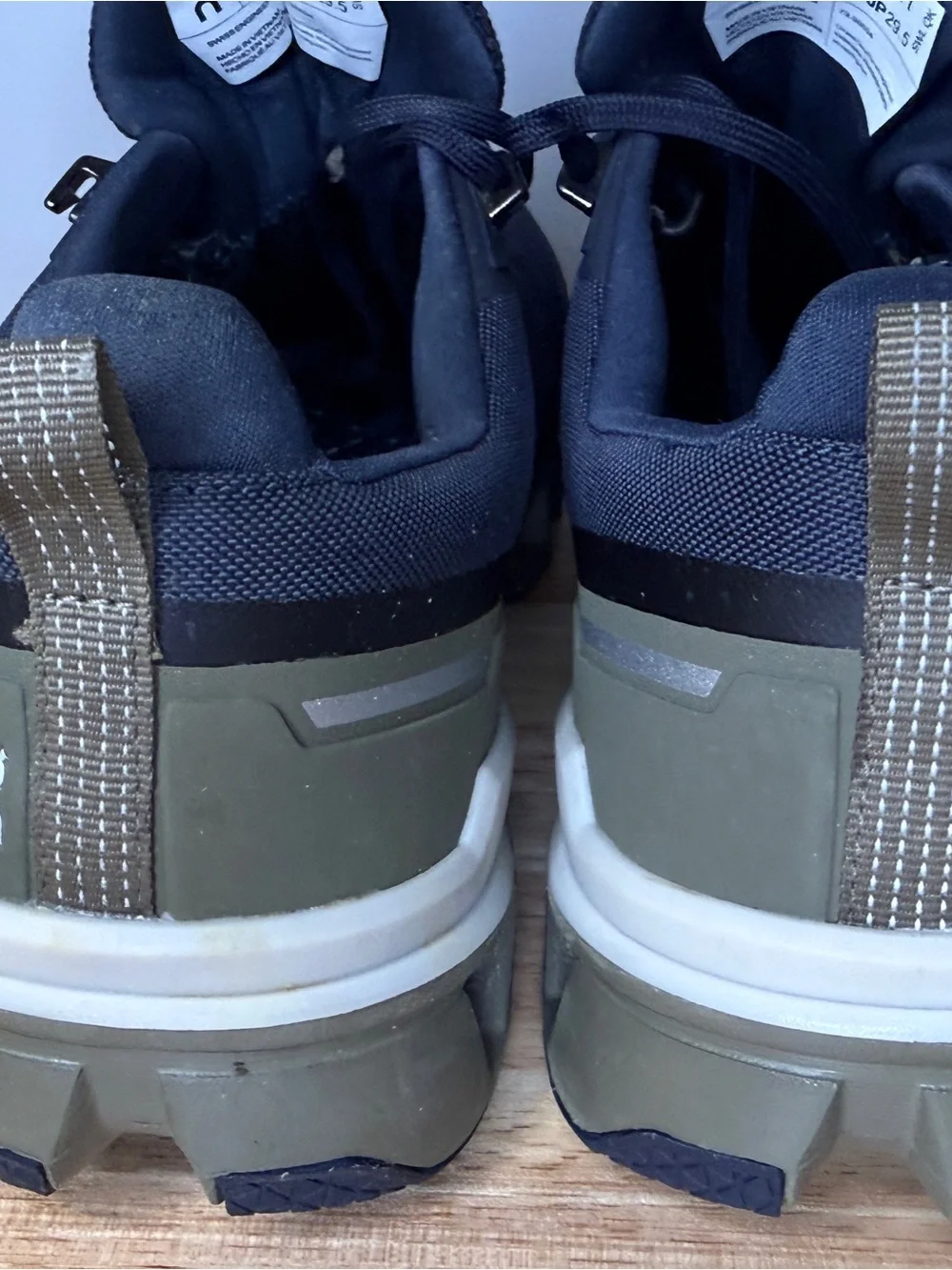 On Waterproof Men's Trail Shoes in midnight blue and Olive